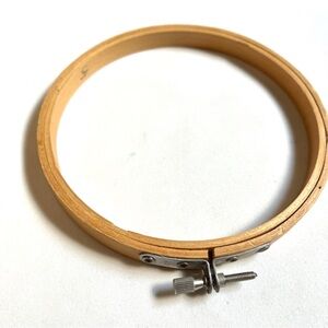 Tan Wooden Needlepoint ring. 5.25 inch diameter